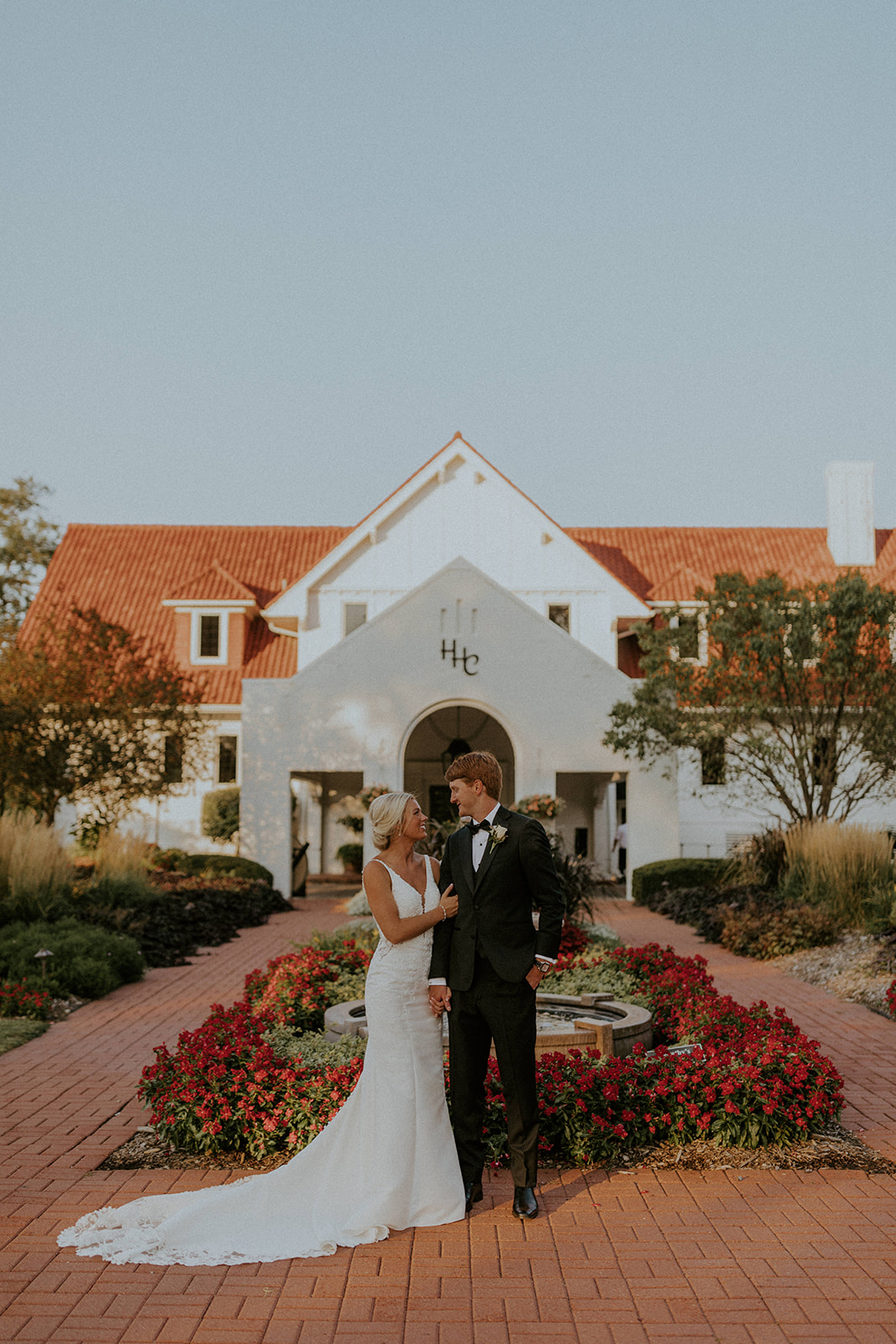 Bride and groom posing for a portrait shot outside Happy Hollow, taken by McKenna Christine Photography