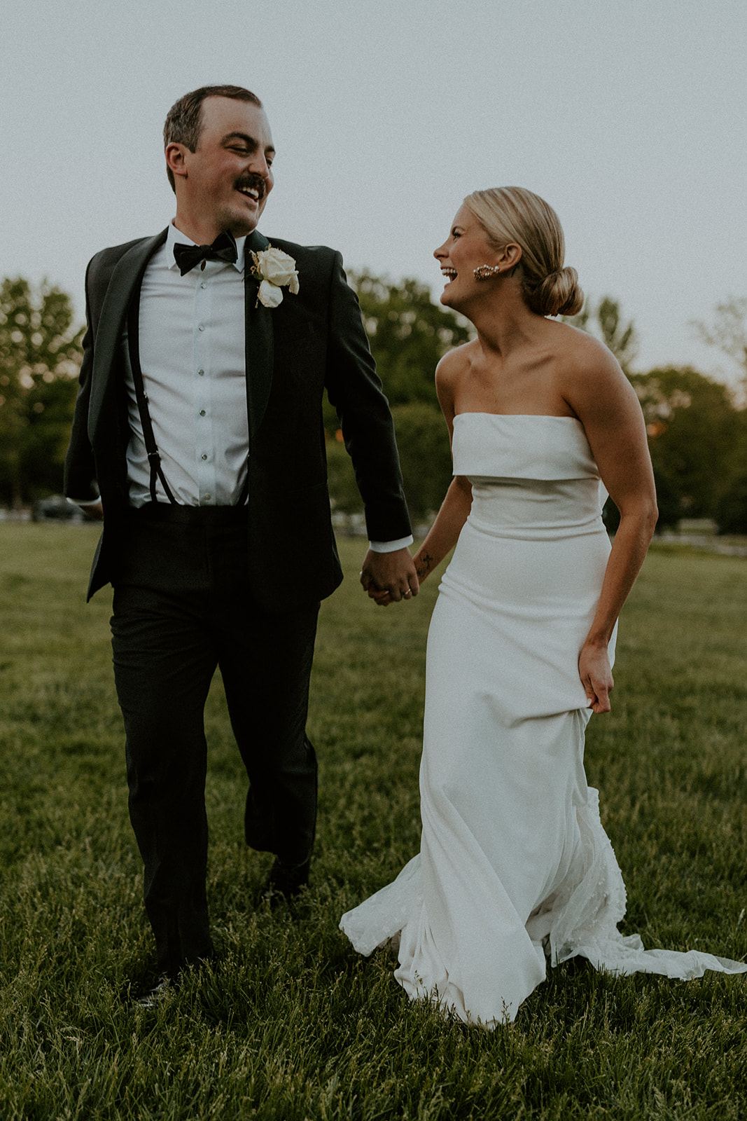 19 Non-Traditional Wedding Ideas To Make Your Wedding Day Uniquely Yours. Couple smiling at each other during their wedding shoot.