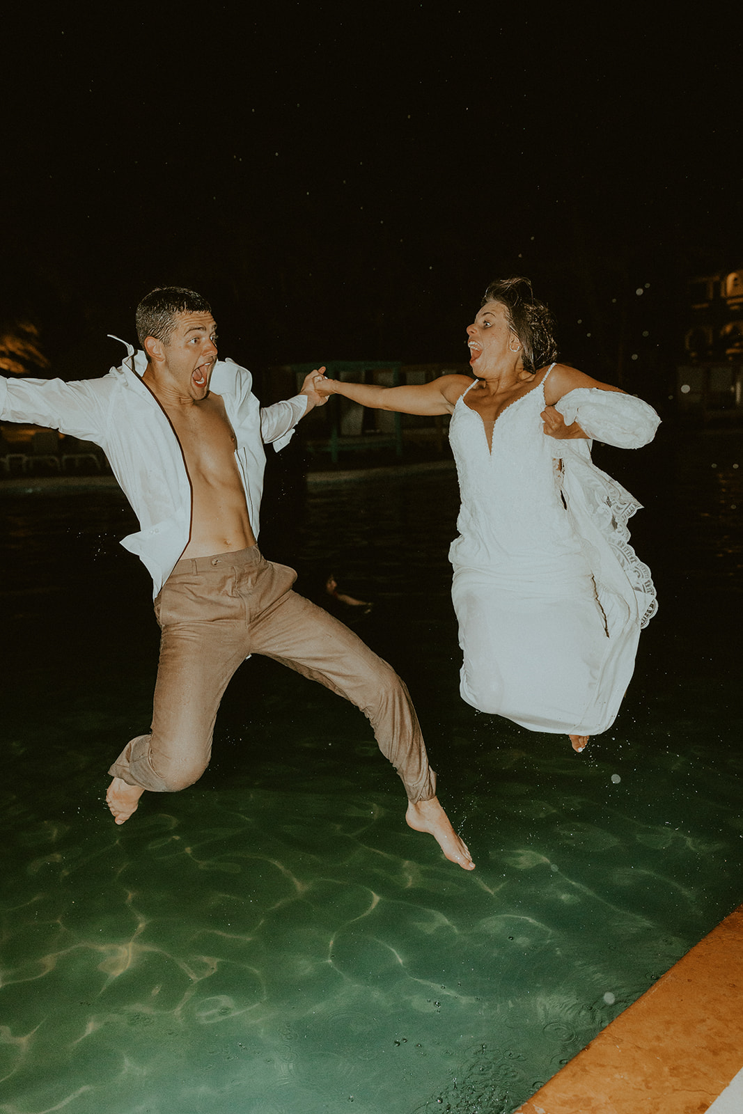19 Non-Traditional Wedding Ideas To Make Your Wedding Day Uniquely Yours. Bride and groom jumping in the water.