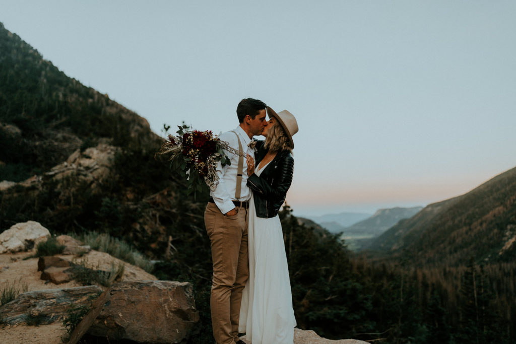 Couple sharing a kiss at Della Terra Mountain Chateau, taken by McKenna Christine Photography